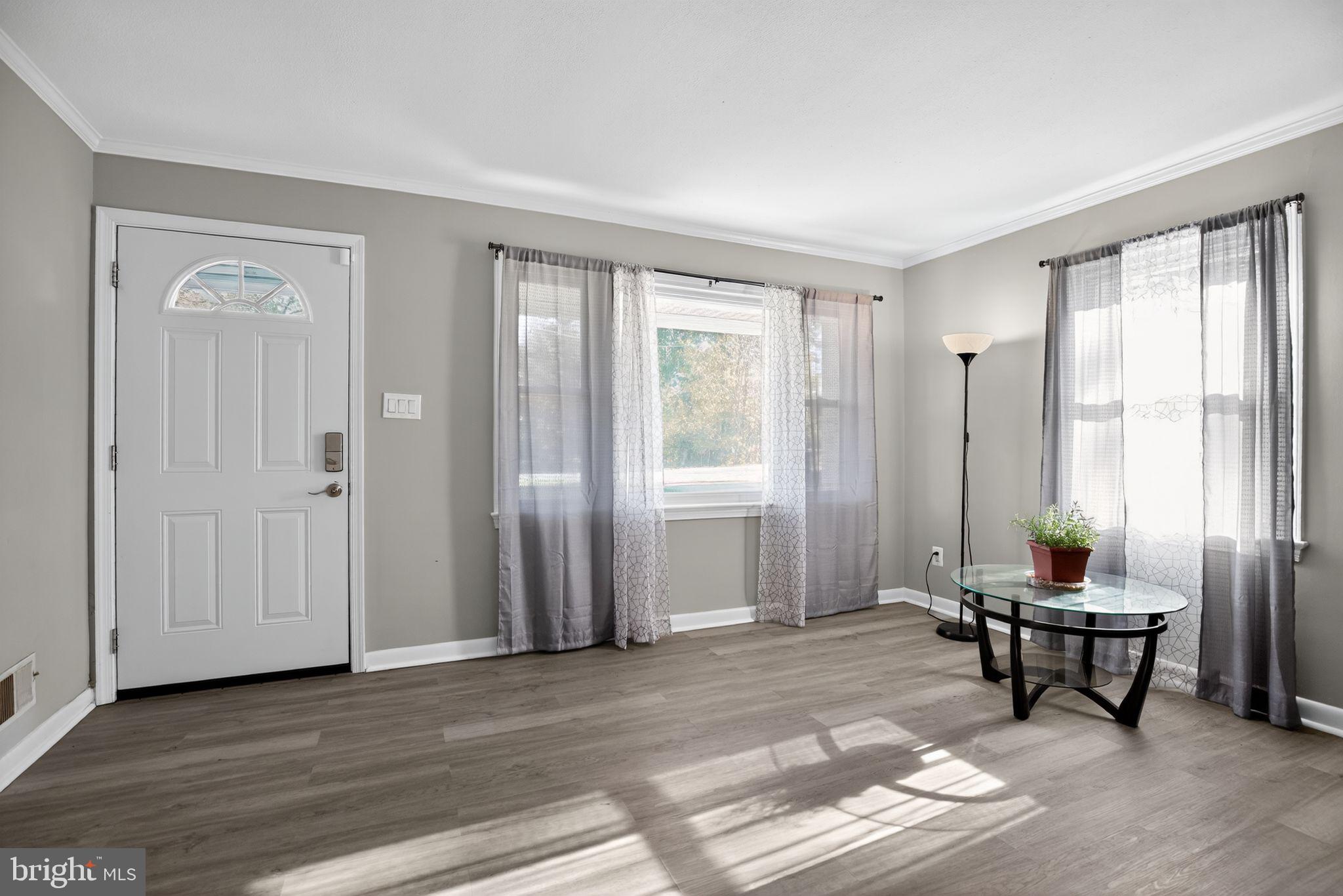 7726 Wills Lane Fort Washington, MD 20744 - Photo 3 of 30 a living room with furniture and a window