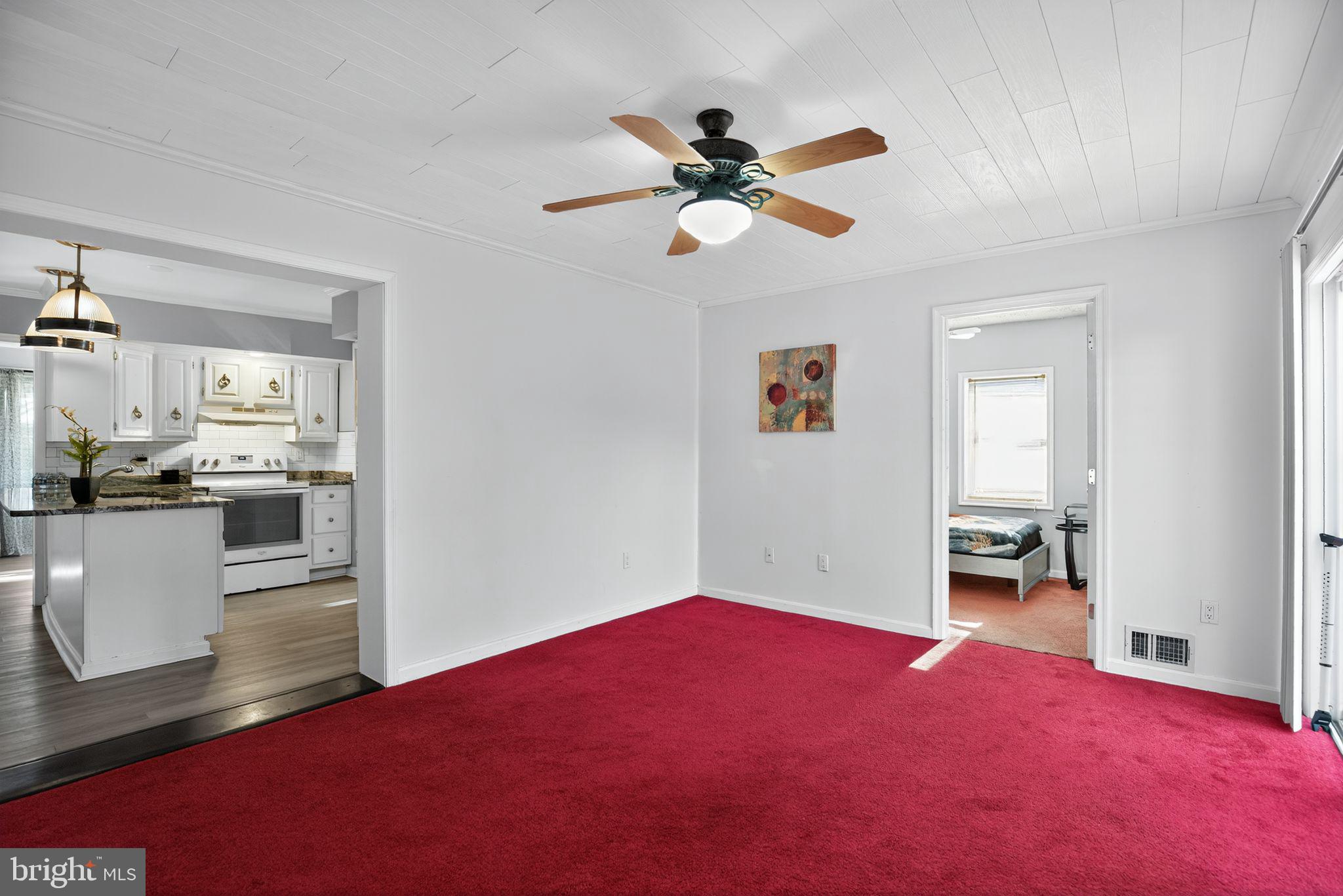 7726 Wills Lane Fort Washington, MD 20744 - Photo 10 of 30 a bedroom with a bed and a chandelier