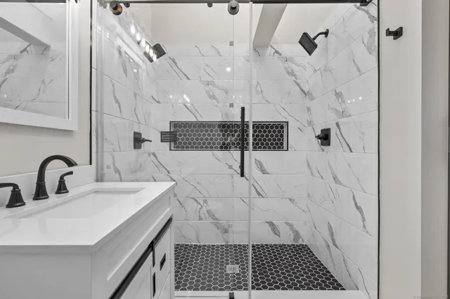 a bathroom with a sink and a mirror