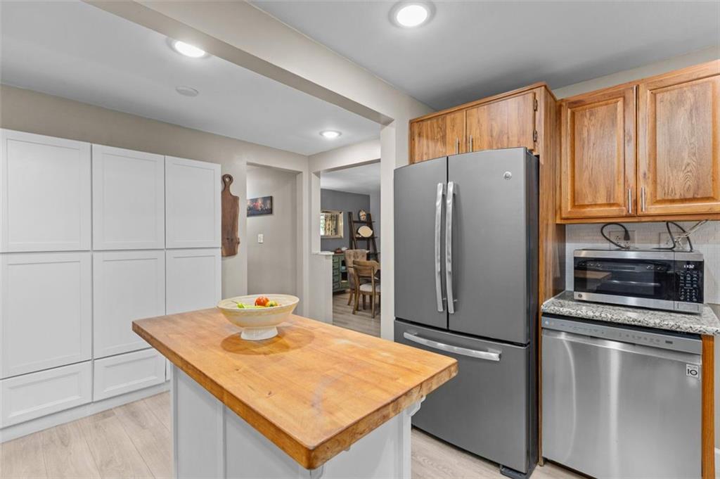 172 North Vireo Drive McKees Rocks, PA 15136 - Photo 11 of 41 a kitchen with stainless steel appliances granite countertop a refrigerator a stove and a sink