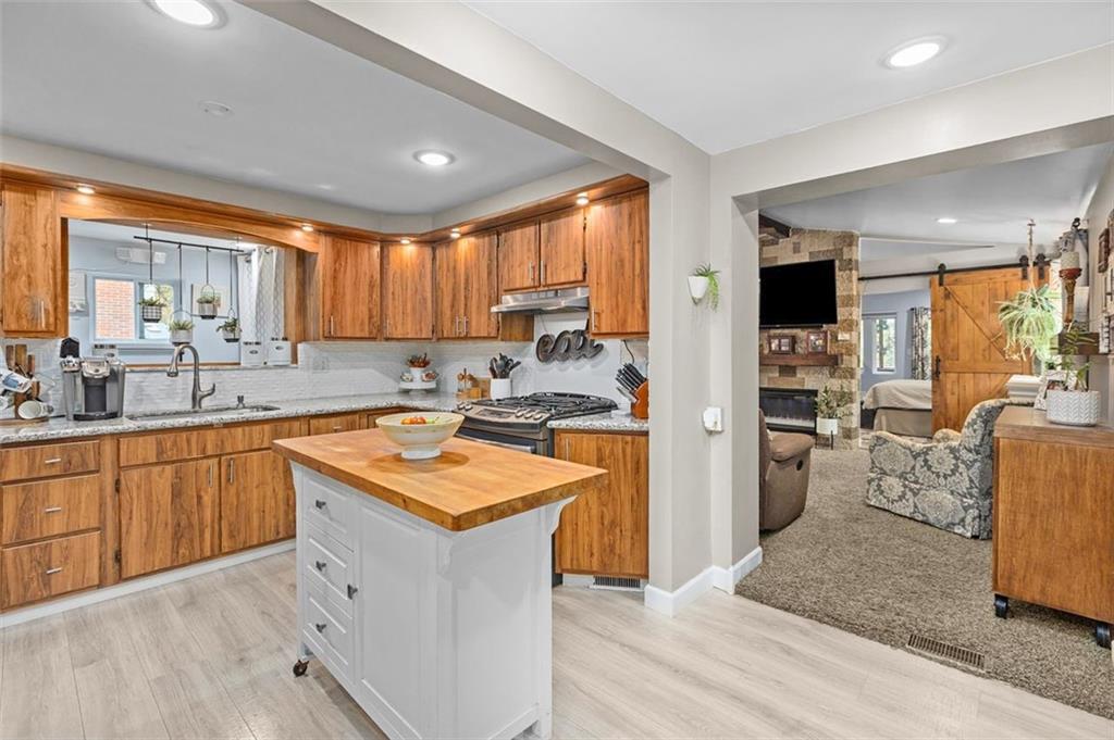 172 North Vireo Drive McKees Rocks, PA 15136 - Photo 12 of 41 a kitchen with stainless steel appliances granite countertop a sink stove and refrigerator
