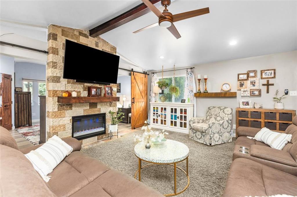 172 North Vireo Drive McKees Rocks, PA 15136 - Photo 14 of 41 a living room with furniture a flat screen tv and a fireplace