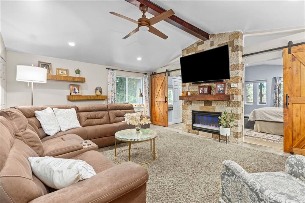 172 North Vireo Drive McKees Rocks, PA 15136 - Photo 15 of 41 a living room with furniture a fireplace and a flat screen tv