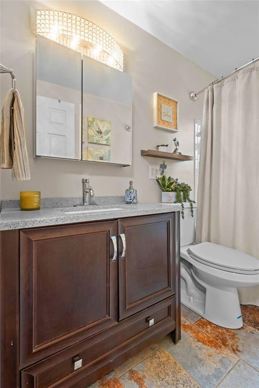 172 North Vireo Drive McKees Rocks, PA 15136 - Photo 24 of 41 a bathroom with a granite countertop toilet sink and mirror