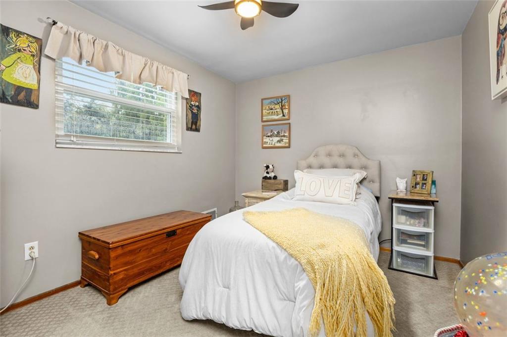 172 North Vireo Drive McKees Rocks, PA 15136 - Photo 25 of 41 a bedroom with a bed and a chandelier