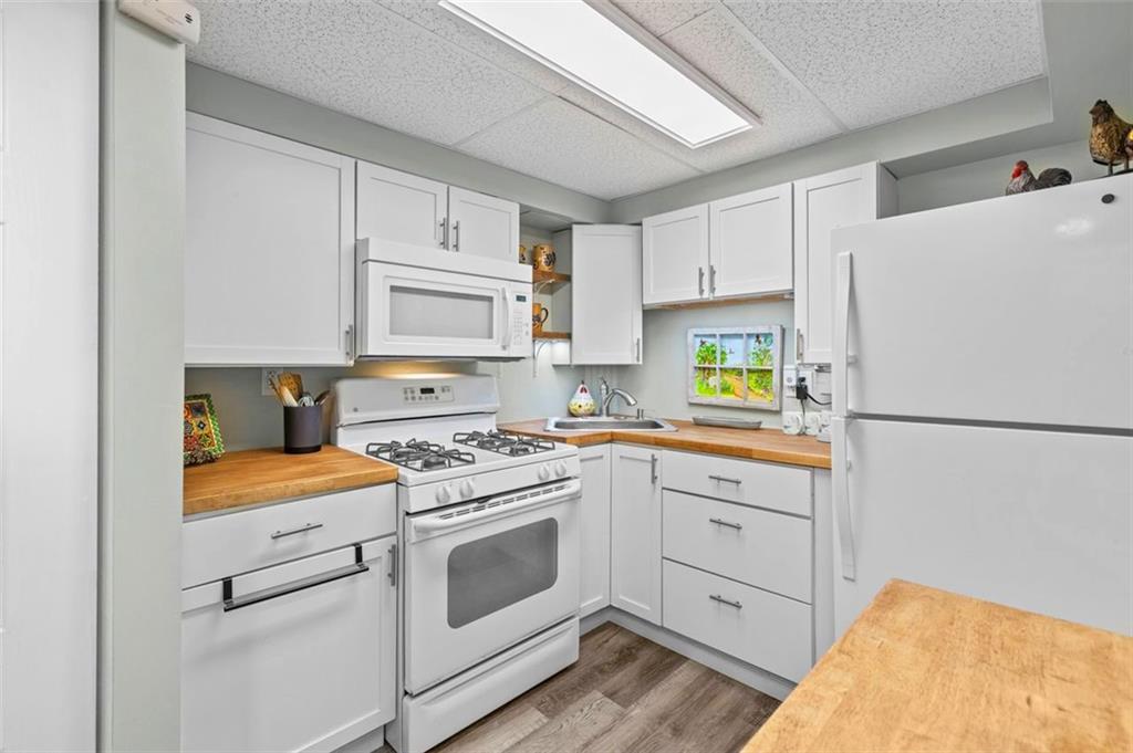 172 North Vireo Drive McKees Rocks, PA 15136 - Photo 31 of 41 a kitchen with white cabinets and white appliances