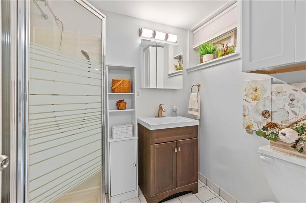 172 North Vireo Drive McKees Rocks, PA 15136 - Photo 32 of 41 a bathroom with a sink a vanity and a window