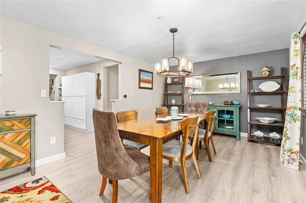 172 North Vireo Drive McKees Rocks, PA 15136 - Photo 6 of 41 a view of a dining room with furniture and wooden floor