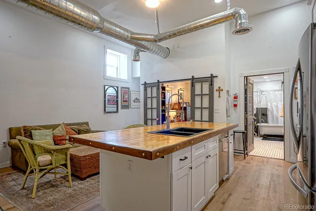 a kitchen that has a table and chairs in it
