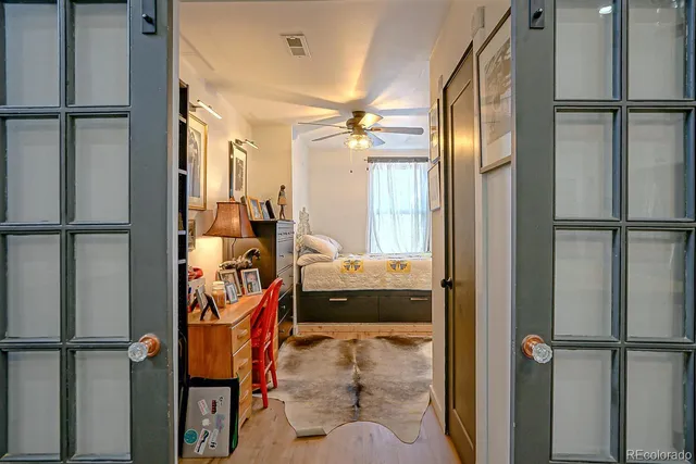 a view of walk in closet and bathroom