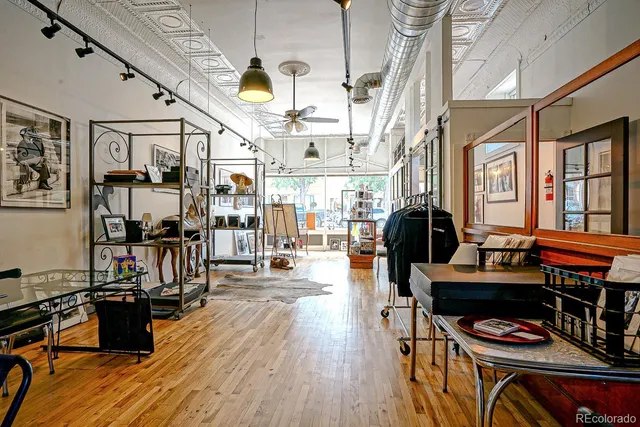 a living room with furniture a piano and a flat screen tv