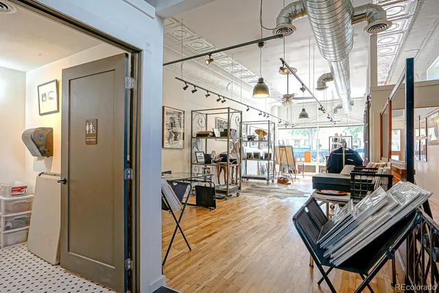 a living room with lots of furniture and a chandelier