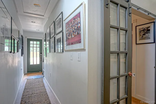 a view of a hallway with a glass door