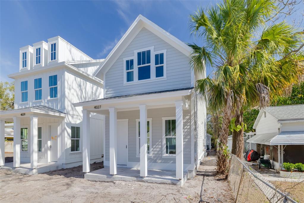 4027 Haines Road North St. Petersburg, FL 33703 - Photo 4 of 13 a front view of a house with a tree