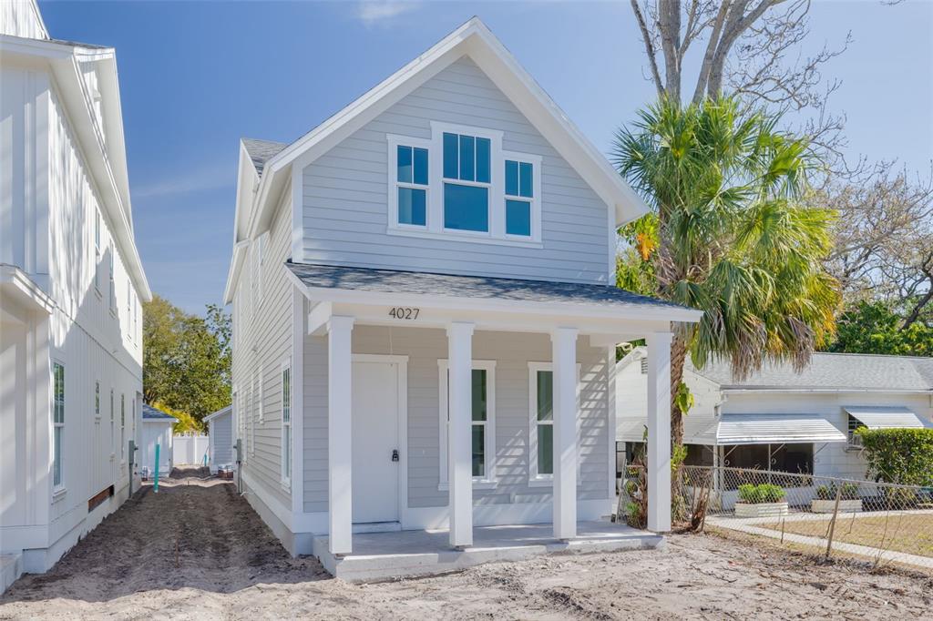 4027 Haines Road North St. Petersburg, FL 33703 - Photo 6 of 13 a front view of a house with a yard