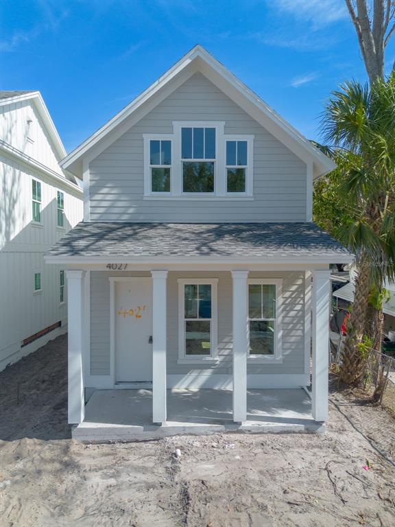 4027 Haines Road North St. Petersburg, FL 33703 - Photo 8 of 13 a front view of a house with a yard
