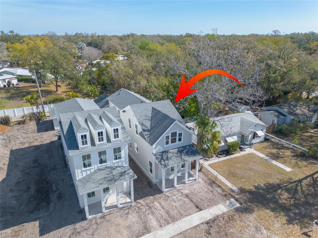 4027 Haines Road North St. Petersburg, FL 33703 - Photo 10 of 13 a view of a house with pool and a yard