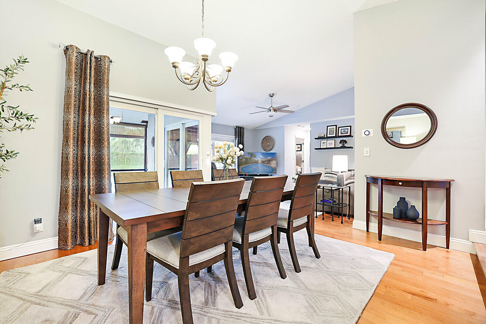 21021 Windemere Lane Boca Raton, FL 33428 - Photo 9 of 48 a dining room with furniture a chandelier and a rug