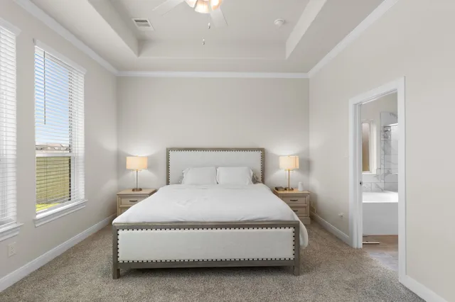 a bedroom with a bed and a night stand