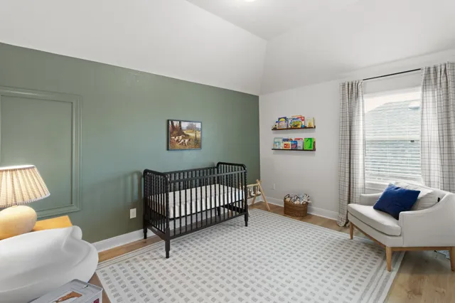 a bedroom with furniture and a window