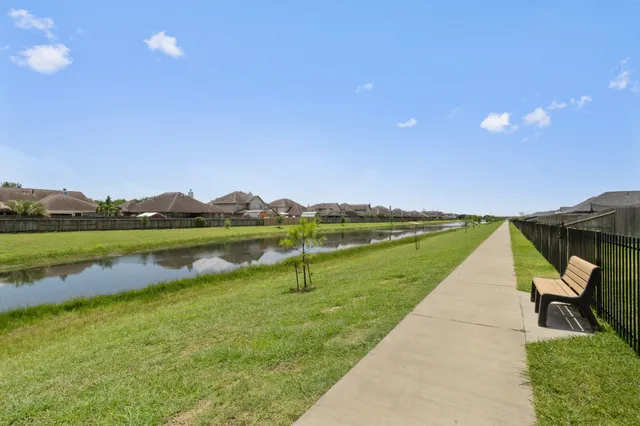a view of lake with green space