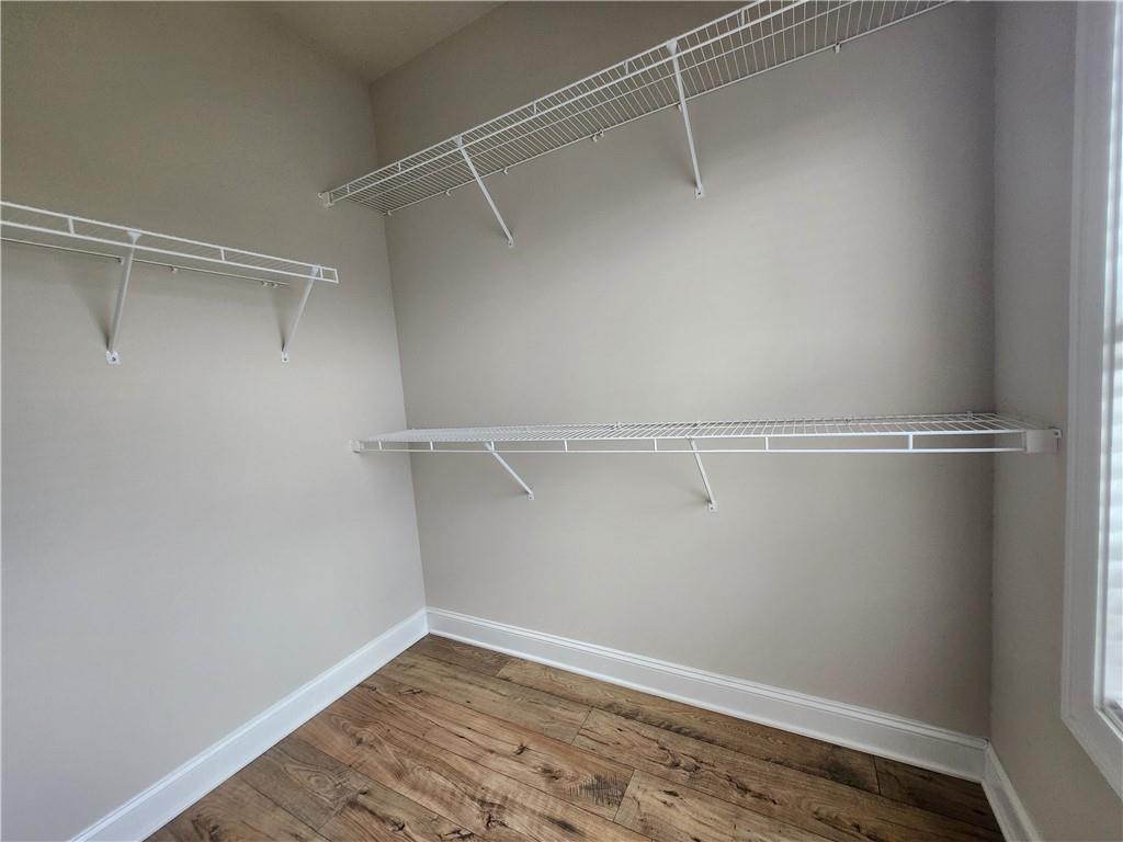 1323 Faircrest Way Suwanee, GA 30024 - Photo 4 of 16 a view of an empty walk in closet