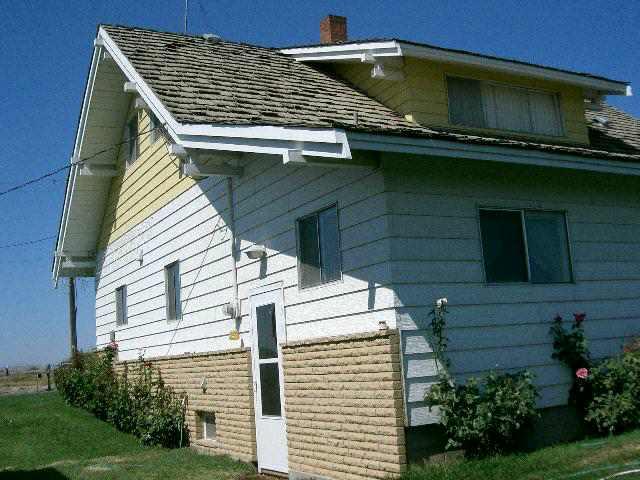1841 Liberty Road Granger, WA 98932 - Photo 2 of 8 a view of a house with a window and yard