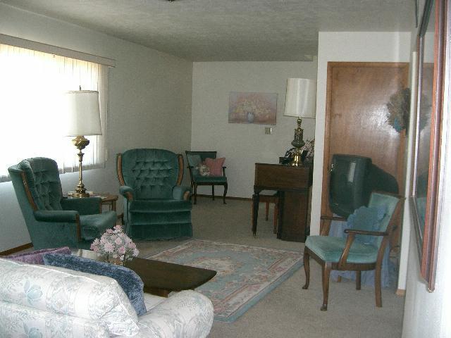 1841 Liberty Road Granger, WA 98932 - Photo 4 of 8 a living room with furniture and a fireplace
