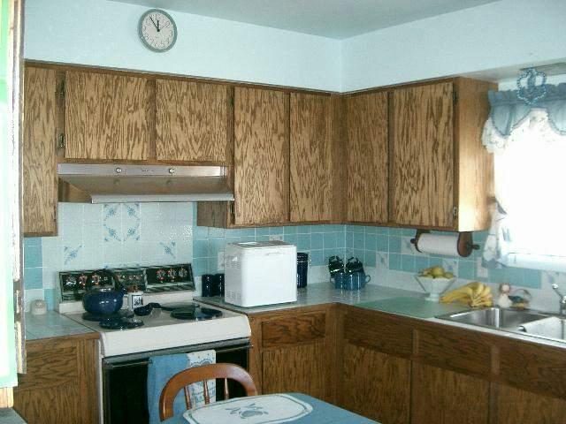 1841 Liberty Road Granger, WA 98932 - Photo 5 of 8 a kitchen with a stove a sink and cabinets