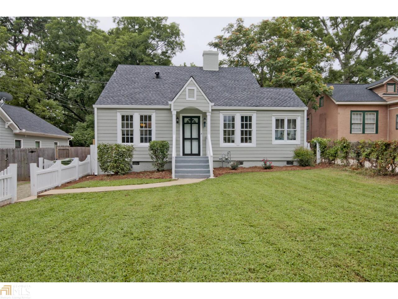 1719 Flat Shoals Road Atlanta, GA 30316 - Photo 1 of 1 a front view of a house with a garden