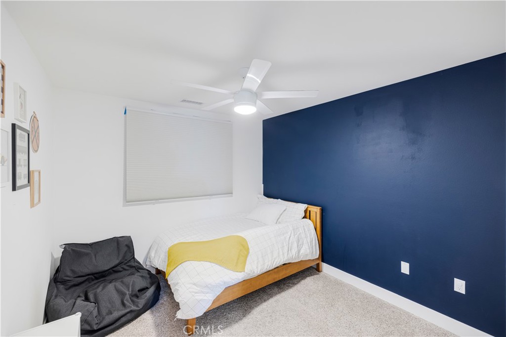 6747 Rhea Court Reseda, CA 91335 - Photo 13 of 26 a bedroom with a bed and a couch