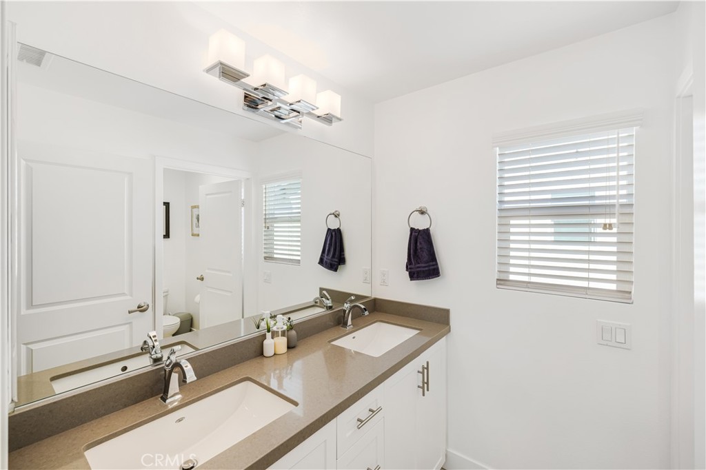 6747 Rhea Court Reseda, CA 91335 - Photo 14 of 26 a bathroom with a sink double vanity granite tub and a mirror