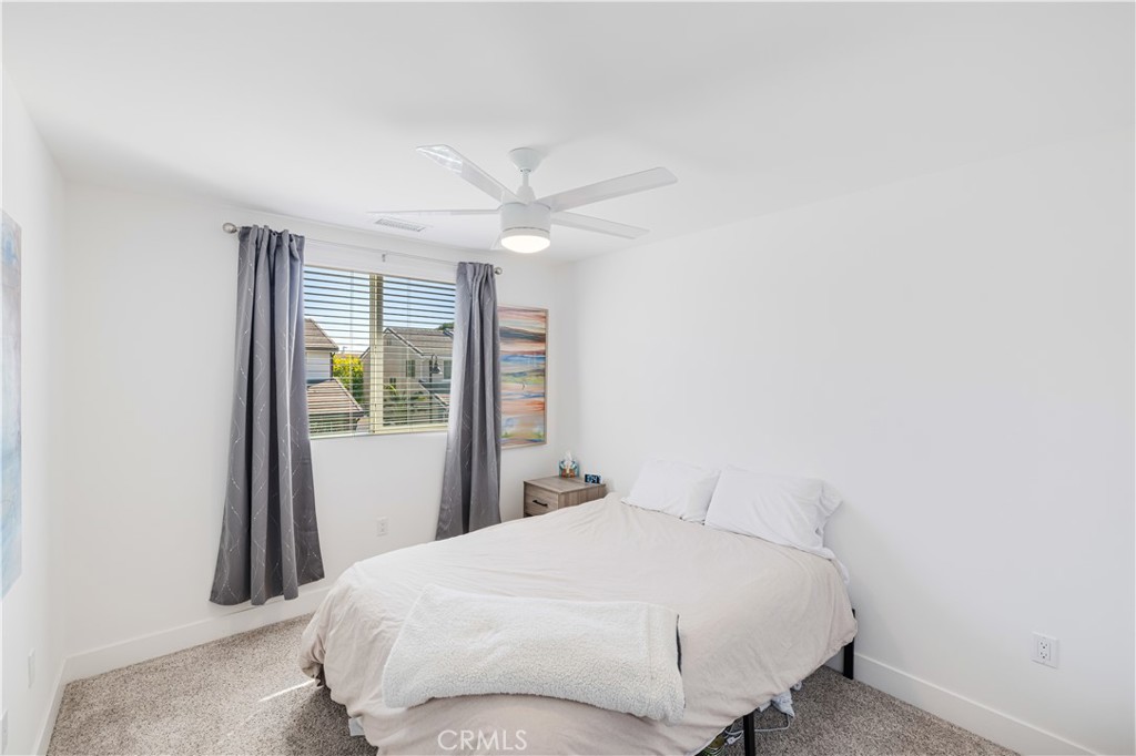 6747 Rhea Court Reseda, CA 91335 - Photo 16 of 26 a bedroom with a bed and a window