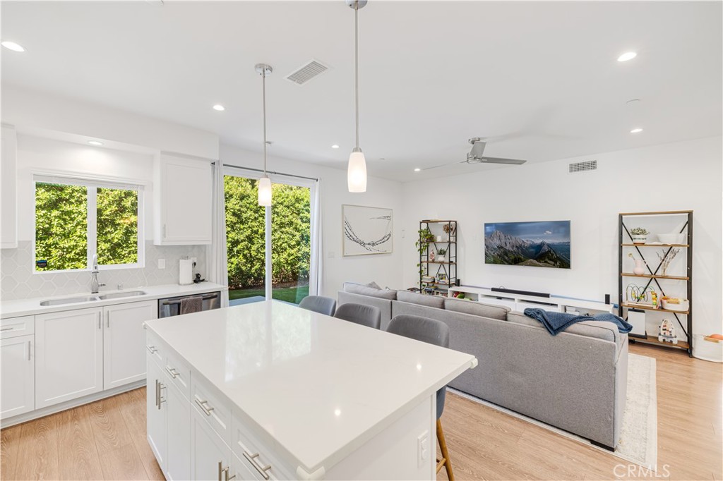 6747 Rhea Court Reseda, CA 91335 - Photo 2 of 26 a large white kitchen with a large window