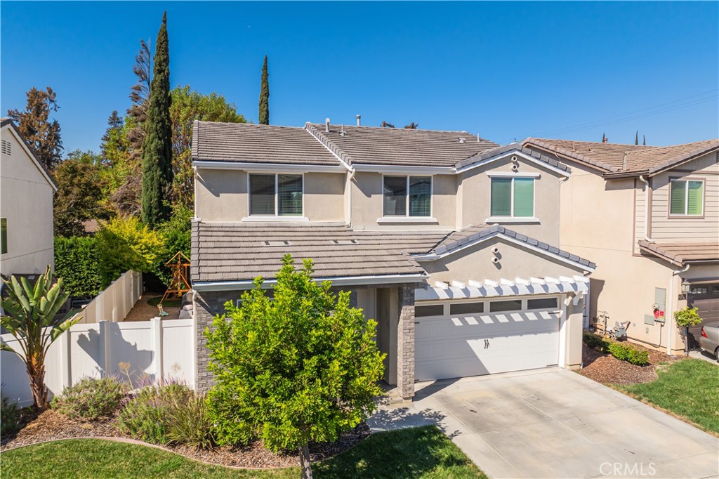6747 Rhea Court Reseda, CA 91335 - Photo 26 of 26 a front view of a house with a garden