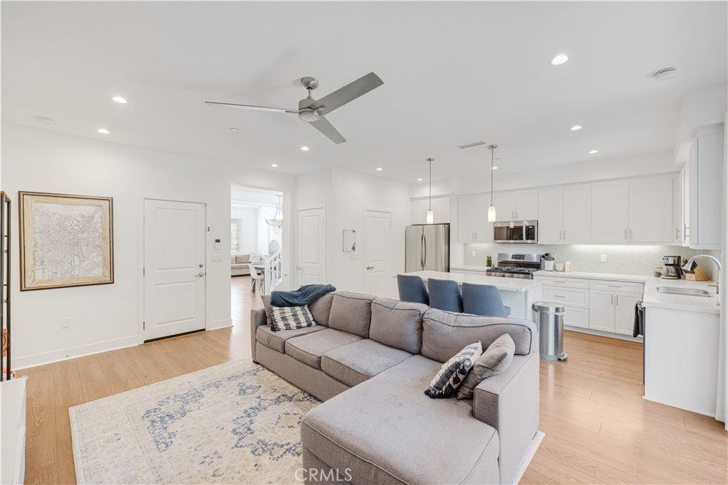 6747 Rhea Court Reseda, CA 91335 - Photo 6 of 26 a living room with furniture and kitchen view