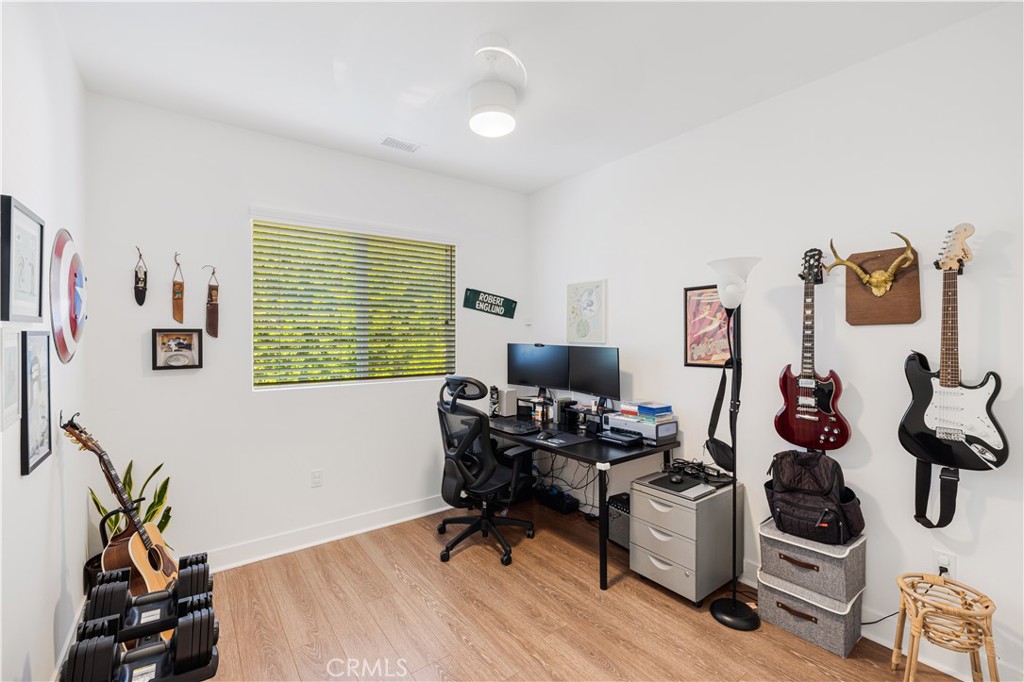 6747 Rhea Court Reseda, CA 91335 - Photo 7 of 26 a workspace with furniture and a window
