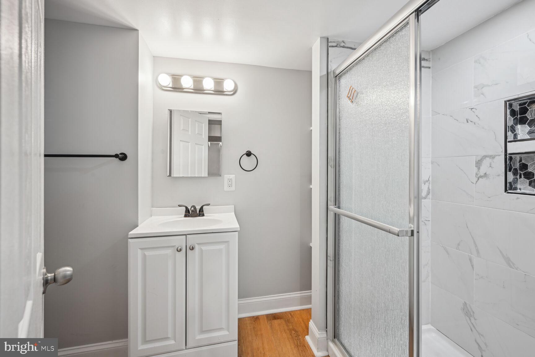 167 V Street Northeast Washington, DC 20002 - Photo 15 of 21 Modern bathroom with sleek finishes.