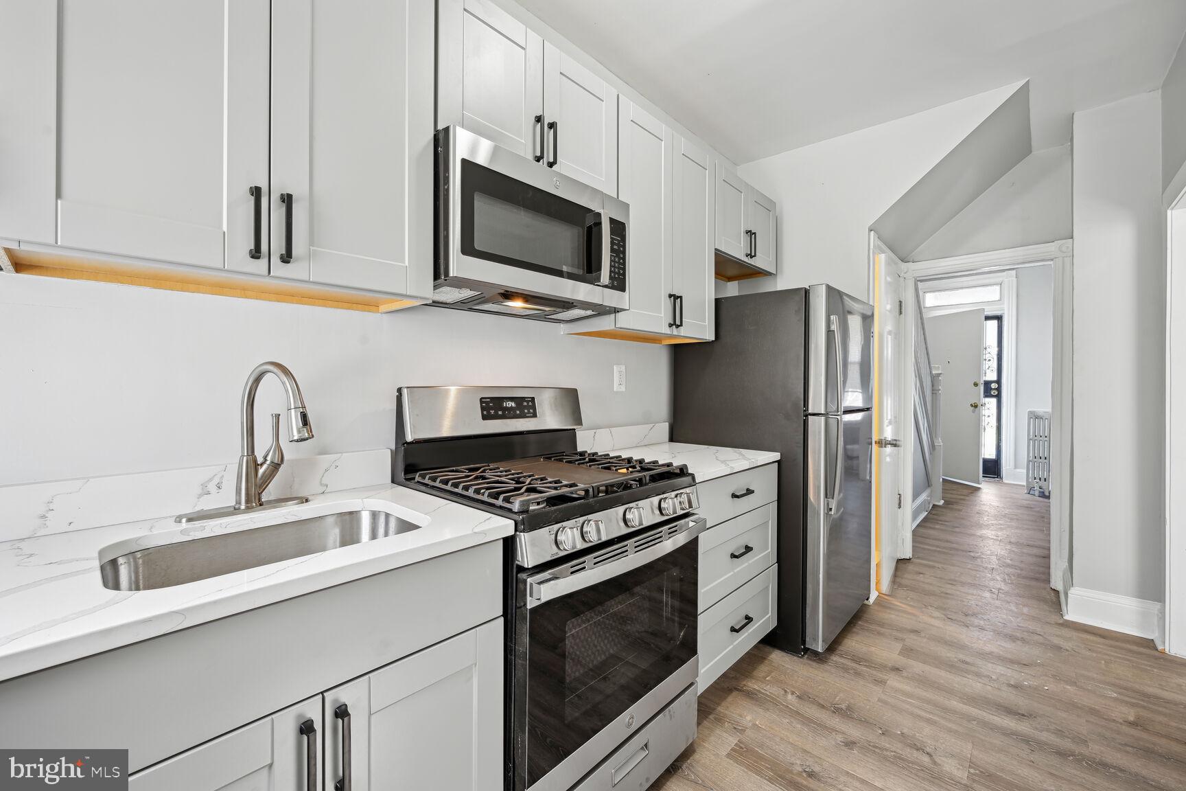 167 V Street Northeast Washington, DC 20002 - Photo 4 of 21 Modern kitchen with sleek finishes.