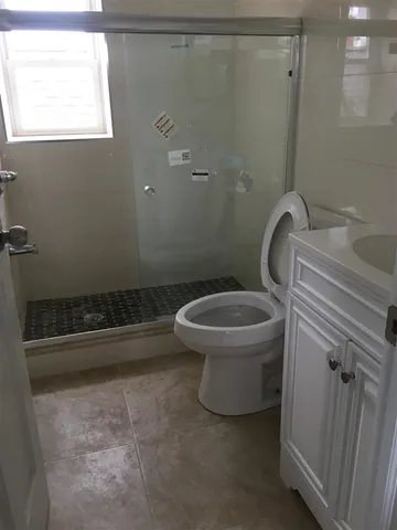 a bathroom with a toilet and a sink
