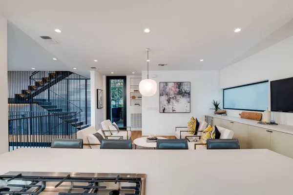 a living room with fireplace furniture and a flat screen tv