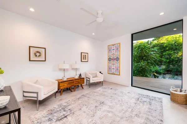 a view of room with window and wooden floor