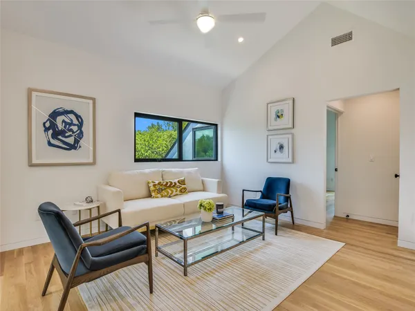 a room with furniture and a large window