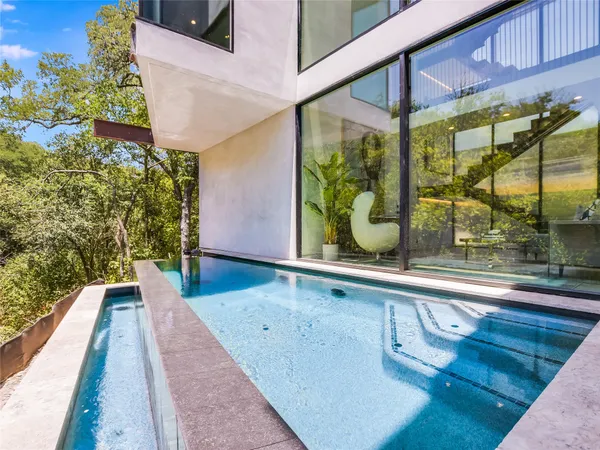 a view of a swimming pool with a patio