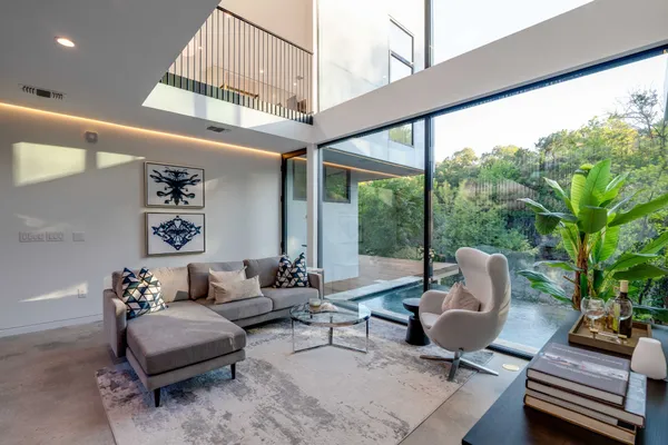 a living room with furniture and a large window