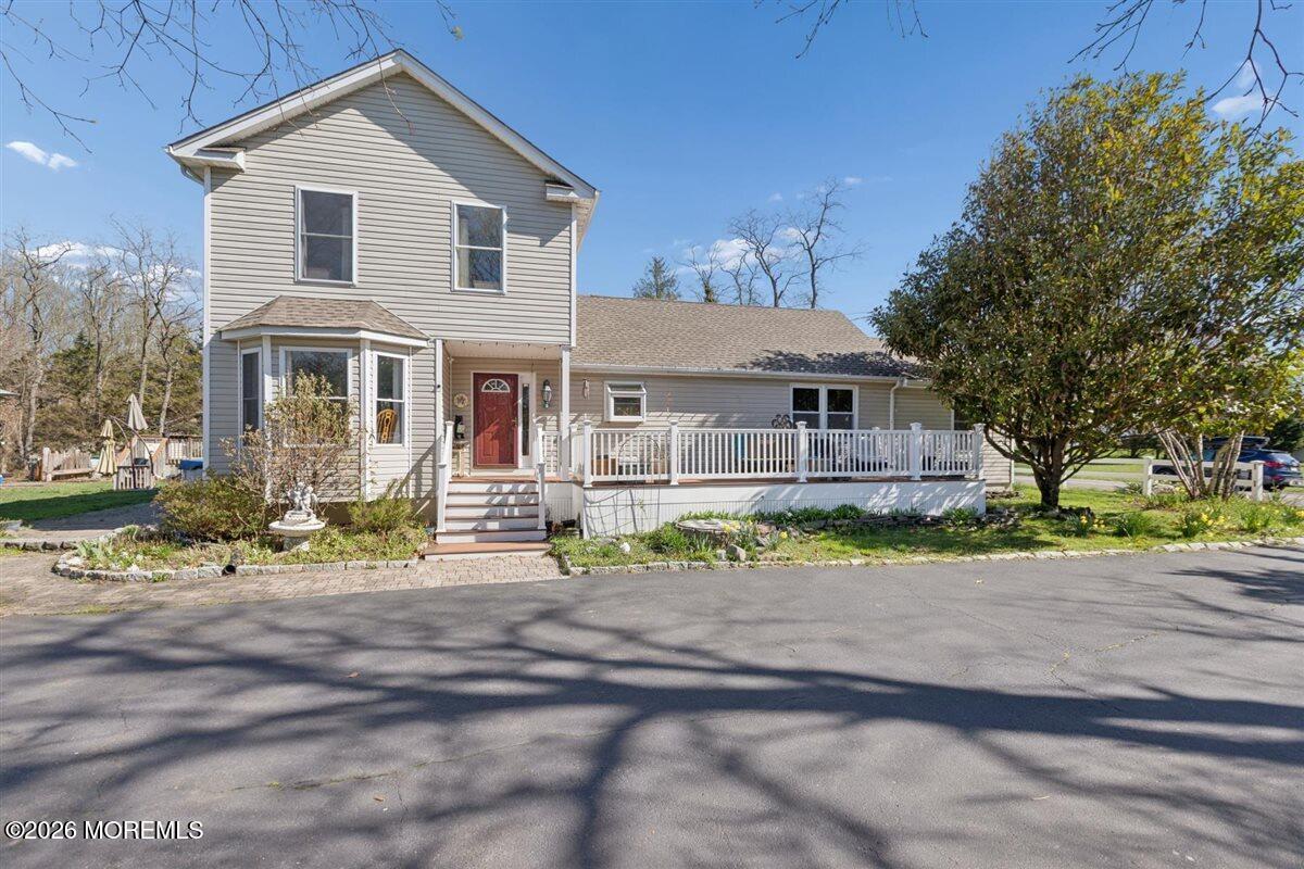 436 Cook Road Jackson, NJ 08527 - Photo 1 of 44 a front view of a house with a yard and a garage