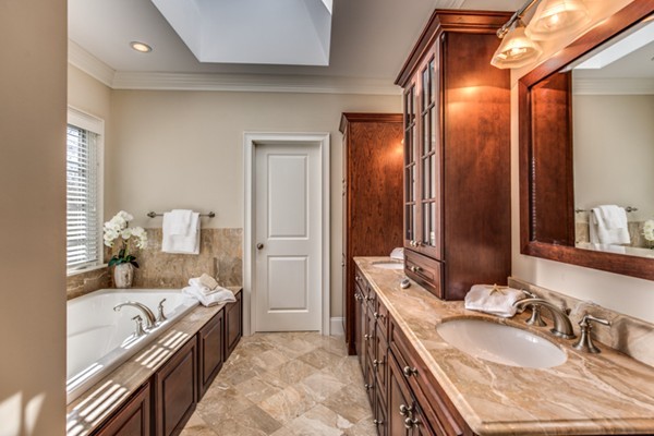24 Burroughs Road Lexington, MA 02420 - Photo 22 of 30 a en suite bathroom with a granite countertop sink and a mirror
