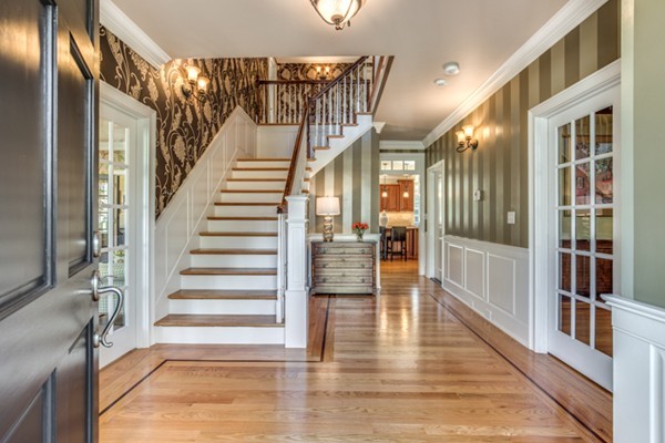 24 Burroughs Road Lexington, MA 02420 - Photo 3 of 30 a view of staircase with lots of frames and chairs