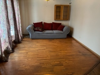 2726 Lancaster Drive Markham, IL 60428 - Photo 5 of 13 a living room with furniture and a couch
