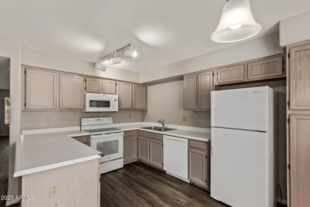 a kitchen with a refrigerator sink and microwave